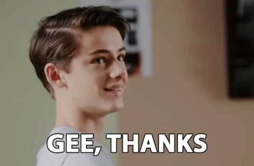 A Young Man Is Smiling With The Words Gee Thanks Above Him GIF