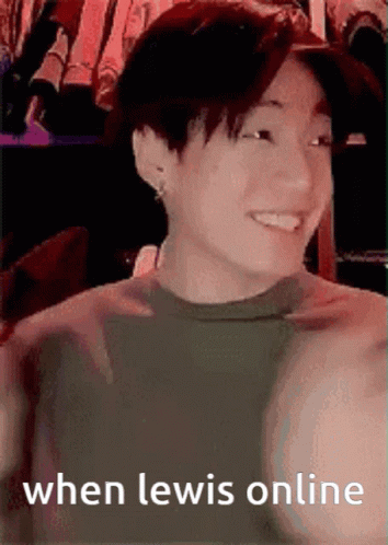 A Young Man Is Smiling With The Words When Lewis Online Written Below Him . GIF