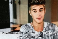 A Young Man Is Talking About His Pants Being Low . GIF