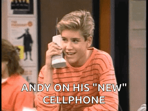 A Young Man Is Talking On A Cellphone With The Words Andy On His New Cellphone Below Him GIF
