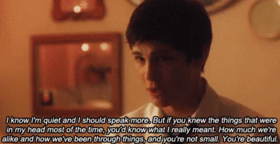 A Young Man Is Talking To Another Young Man In A Room With A Quote . GIF