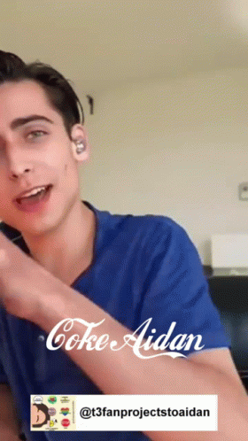 A Young Man Is Wearing A Blue Shirt That Says Coke Aidan On It GIF