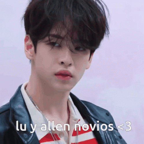 a young man is wearing a leather jacket and a striped shirt with the words lu y allen novios < 3 on the bottom
