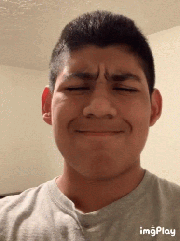 A Young Man Making A Funny Face With Imgplay Displayed On The Bottom Right GIF
