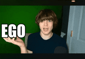 A Young Man Says Ego In Front Of A Green Wall GIF