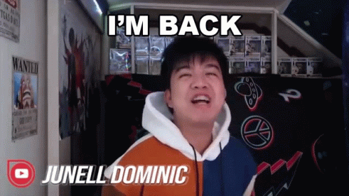 A Young Man Says I 'M Back While Standing In Front Of A Wanted Poster GIF