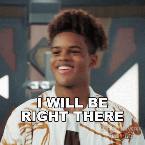 A Young Man Says I Will Be Right There While Smiling GIF