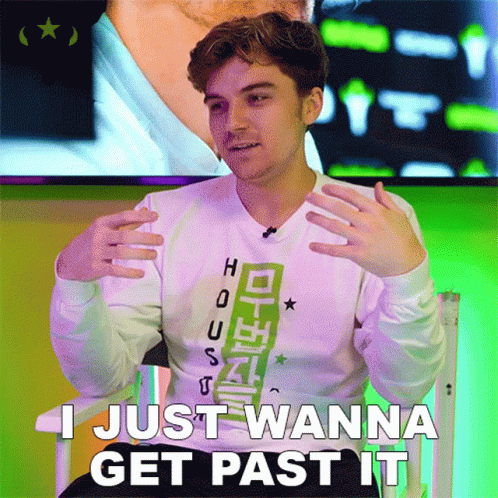A Young Man Sitting In A Chair With The Words I Just Wanna Get Past It GIF