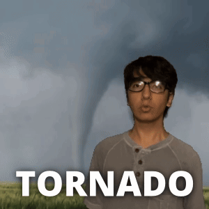 A Young Man Stands In Front Of A Tornado GIF
