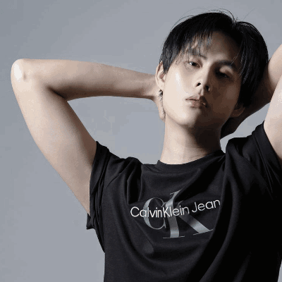 A Young Man Wearing A Black Calvin Klein Jean T-Shirt GIF