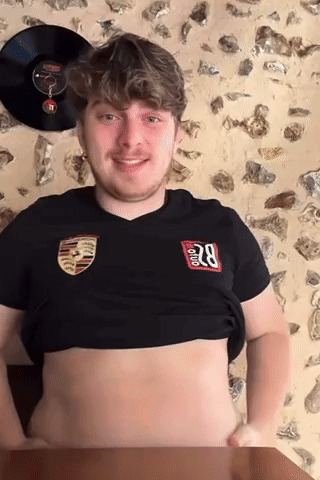 A Young Man Wearing A Black Shirt With The Number 28 On It GIF