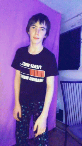 A Young Man Wearing A Black T-Shirt That Says ' Lte2e ' On It GIF