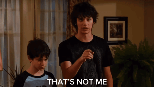 A Young Man Wearing A Black T-Shirt That Says ' Nirvana ' On It GIF