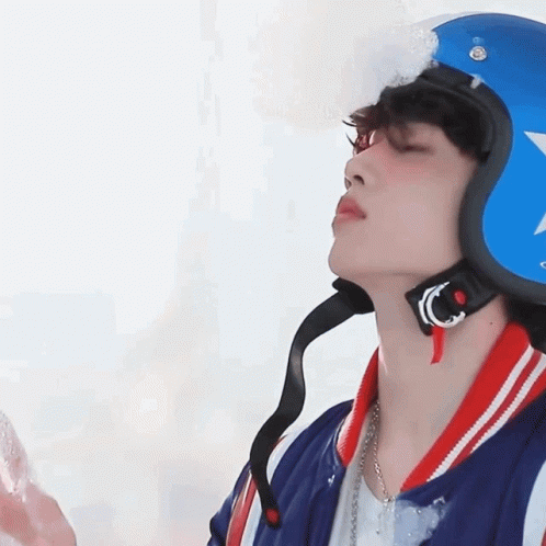 A Young Man Wearing A Blue Helmet With A Star On It GIF