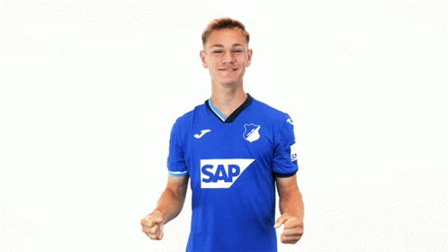 a young man wearing a blue shirt with the word sap on it