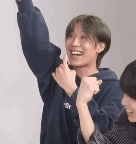 A Young Man Wearing A Blue Sweatshirt That Says Isi On It GIF
