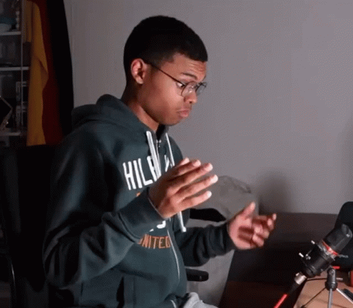 A Young Man Wearing A Green Hoodie That Says United On It GIF