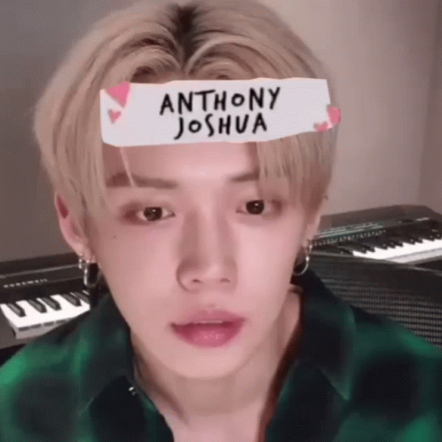 Young Man In Green Plaid Shirt With Joshua Sticker GIF
