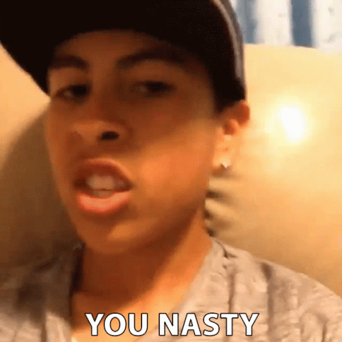 A Young Man Wearing A Hat And A Gray Shirt Says You Nasty GIF