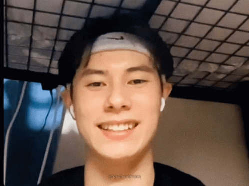 A Young Man Wearing A Headband With The Nike Logo On It GIF