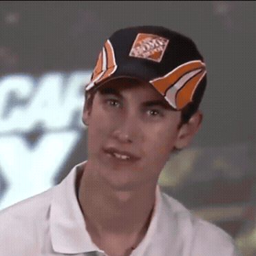 A Young Man Wearing A Home Depot Hat Looks At The Camera GIF