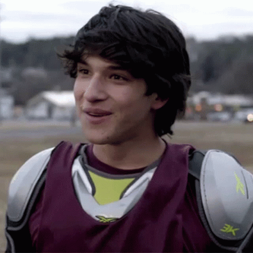 A Young Man Wearing A Jersey That Has The Letter X On It GIF