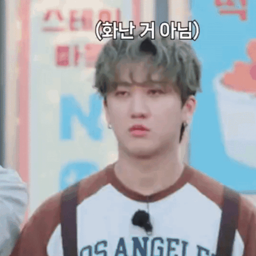A Young Man Wearing A Los Angeles Shirt And Suspenders Is Making A Sad Face . GIF