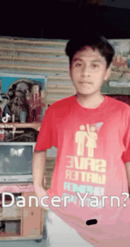 A Young Man Wearing A Red Shirt That Says " Dancer Yarn " GIF