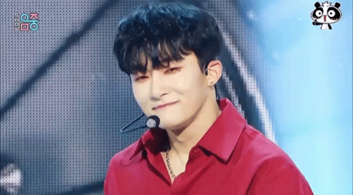 A Young Man Wearing A Red Shirt With A Microphone On His Neck GIF