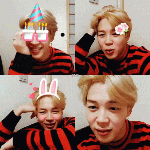 A Young Man Wearing A Striped Shirt And Bunny Ears GIF