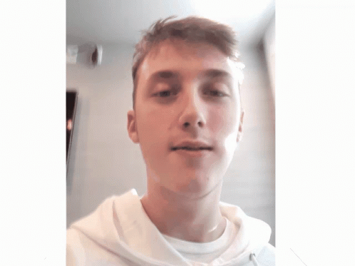 A Young Man Wearing A White Shirt And A White Hoodie GIF