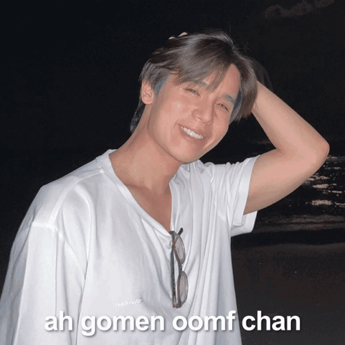 A Young Man Wearing A White Shirt With The Words Ah Gomen Oomf Chan On The Bottom Right GIF
