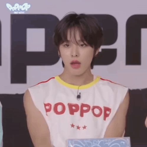 A Young Man Wearing A White Tank Top That Says Poppop On It GIF
