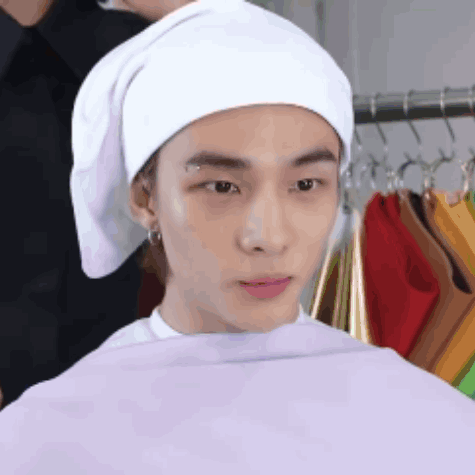 Young Man Sitting With White Towel GIF