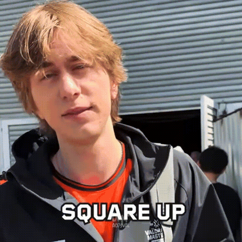 a young man wearing an orange shirt and a black jacket with the words square up above him