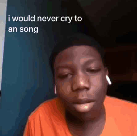 A Young Man Wearing An Orange Shirt Says He Would Never Cry To A Song GIF