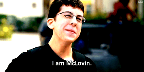 A Young Man Wearing Glasses And A Black Shirt Says I Am Mclovin GIF