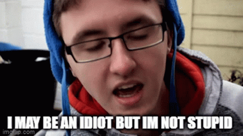 A Young Man Wearing Glasses And A Blue Hat Is Saying I May Be An Idiot But Im Not Stupid GIF
