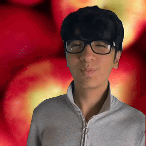 A Young Man Wearing Glasses And A Grey Jacket Stands In Front Of A Red Background GIF