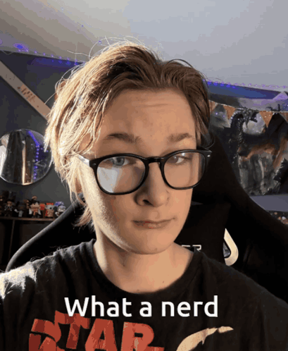A Young Man Wearing Glasses And A Star Wars Shirt Says " What A Nerd " GIF