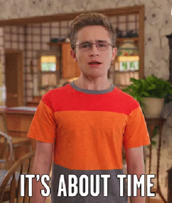 A Young Man Wearing Glasses And An Orange Striped Shirt Says It 'S About Time . GIF
