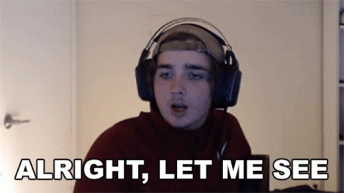 A Young Man Wearing Headphones And A Hat Says Alright Let Me See GIF