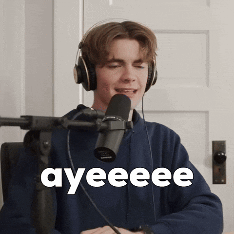A Young Man Wearing Headphones Is Singing Into A Microphone And The Word Ayeeee Is On The Screen Behind Him GIF
