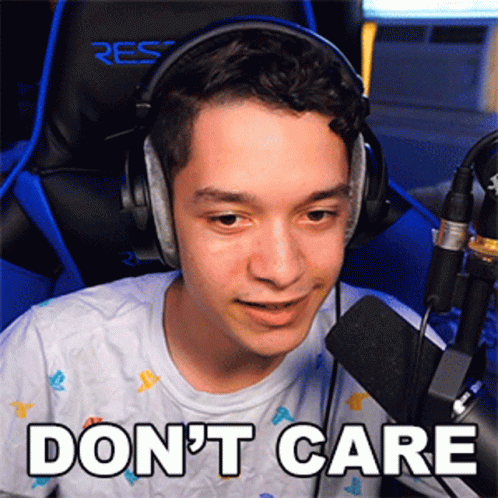 A Young Man Wearing Headphones Is Sitting In Front Of A Microphone And Says Do N't Care GIF