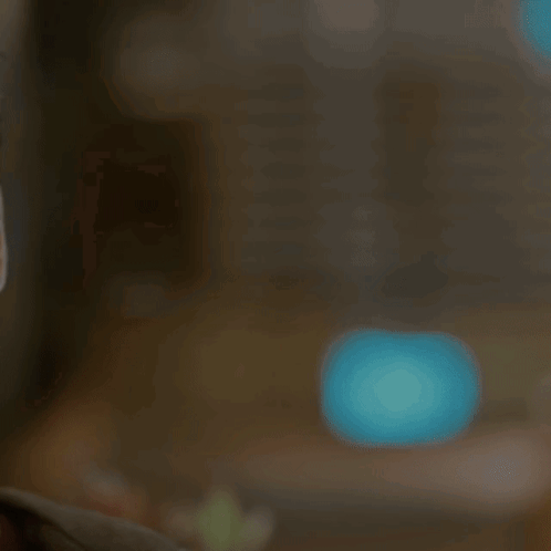 A Young Man Wearing Sunglasses Looks At The Camera With A Serious Look On His Face GIF