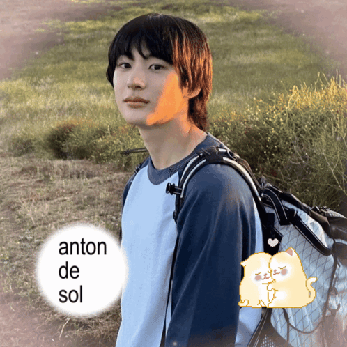 a young man with a backpack stands in a field with the name anton de sol written on the bottom