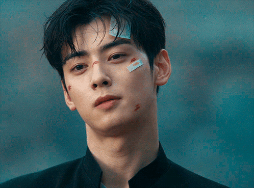 A Young Man With A Bandage On His Forehead GIF