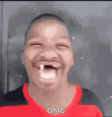 A Young Man With A Missing Tooth Is Making A Funny Face . GIF