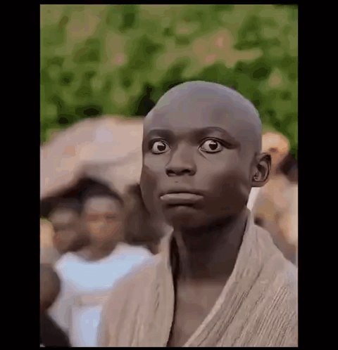 Young Man With Shaved Head Making Funny Face GIF