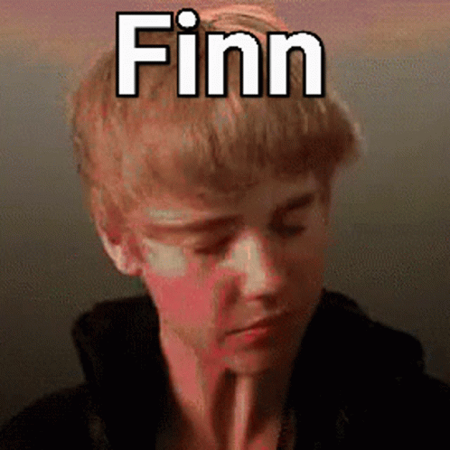 A Young Man With A Straw In His Mouth And The Name Finn Above His Head GIF